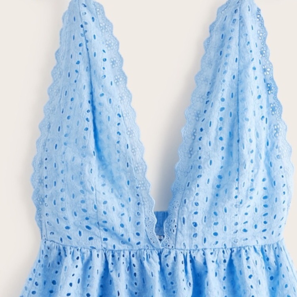 Baby blue low cut cami top. Adjustable straps.